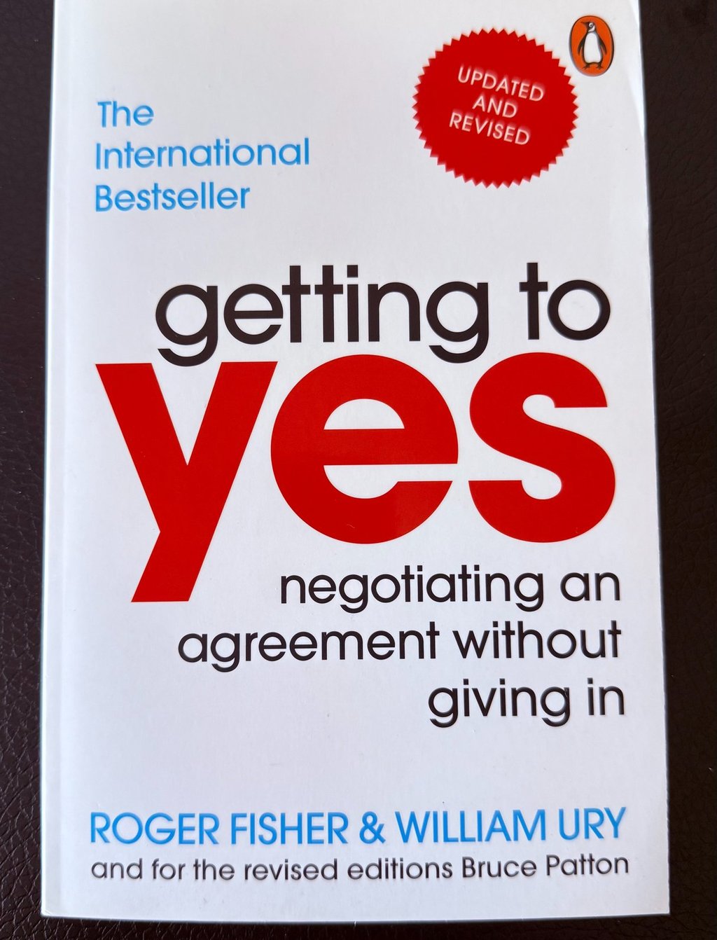 a book cover of getting to yes