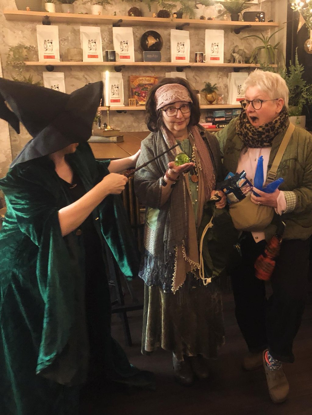 three women at a Harry Potter themed quiz. one looks shocked.