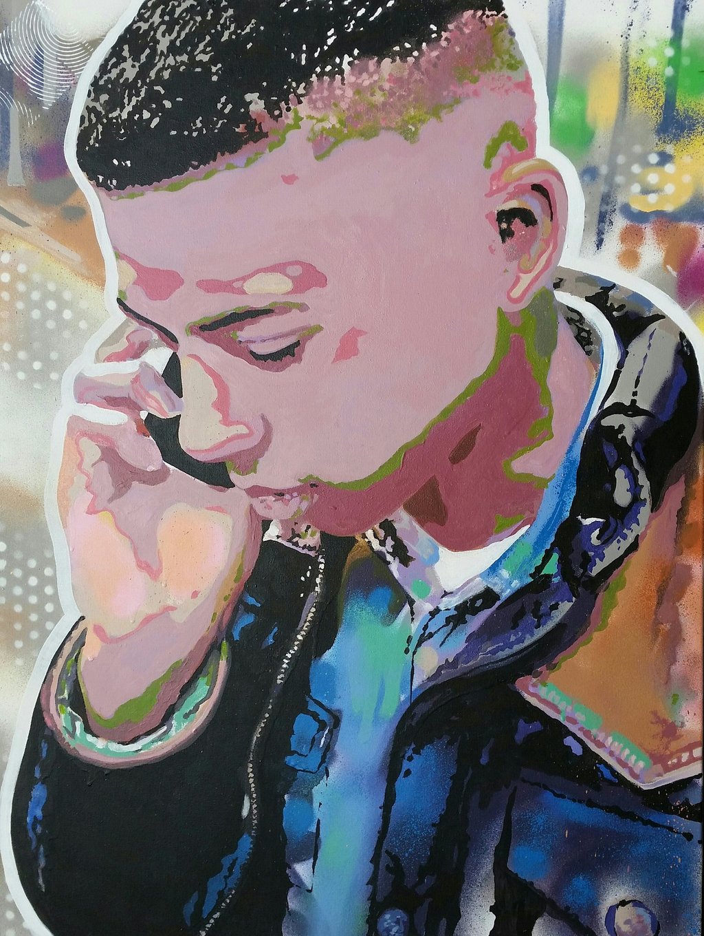 A colorful stencil art portrait of a young man on his phone with vibrant spray paint highlights.