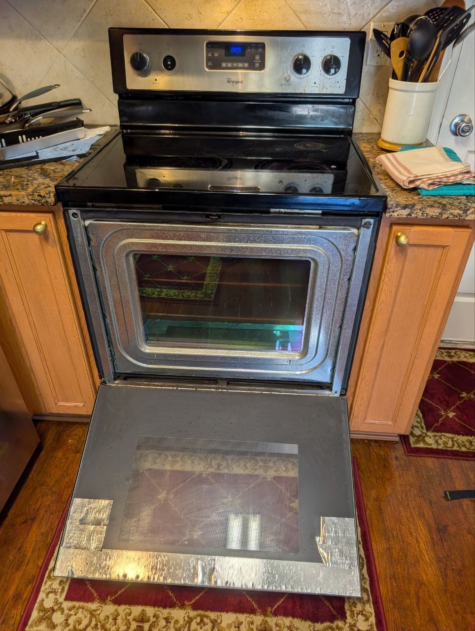 whirlpool oven broken door repair
