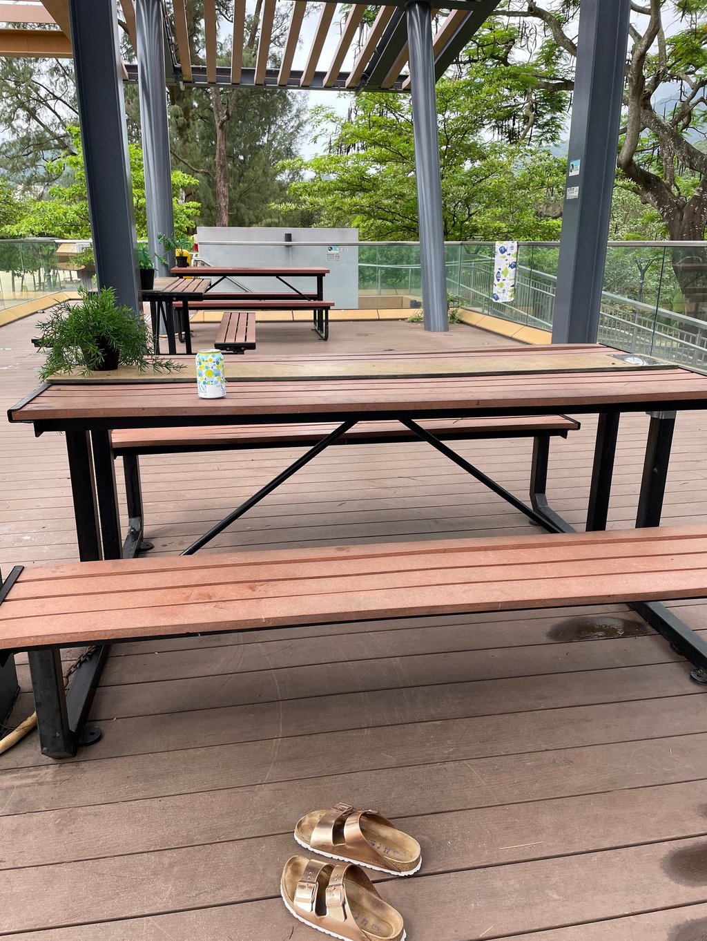 wooden desk and a pair of sandals