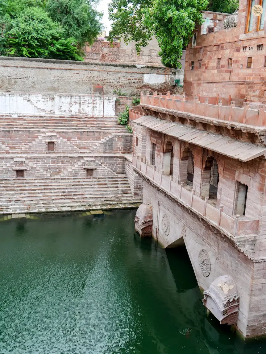 Historic Toorji ka Jhalra stepwell in the Blue City of Jodhpur, showcasing layered steps and deep water.