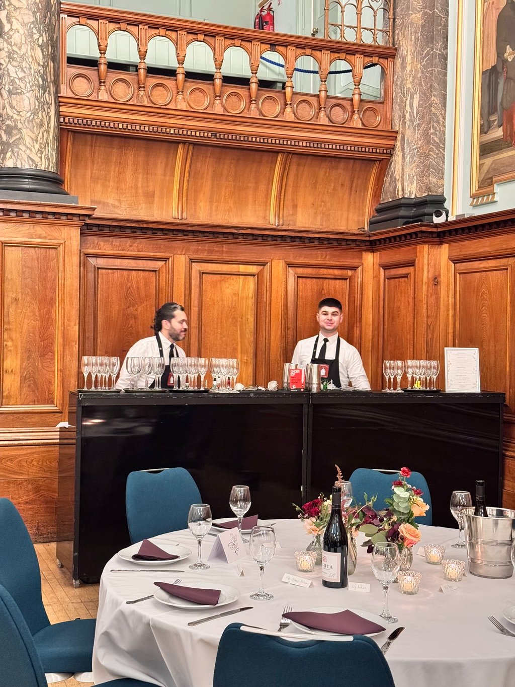 Professional bartenders serving drinks at wedding bar hire London