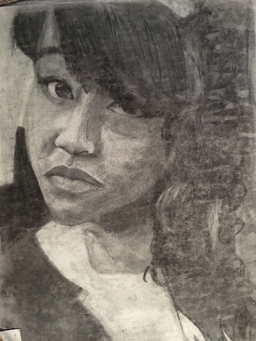 charcoal self portrait. black girl artist