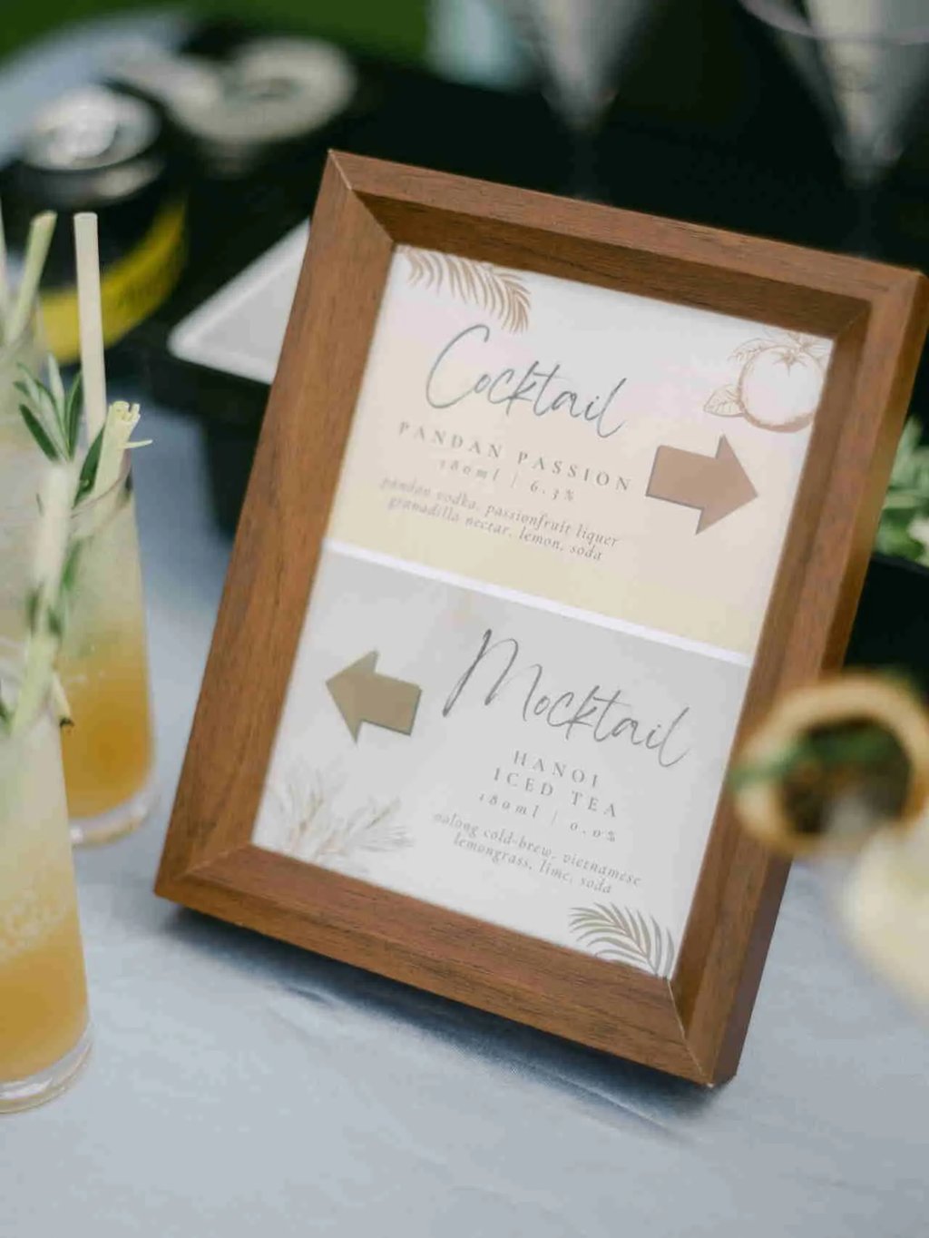 Personalized event cocktail menu frame on a bar top at a Sai Kung HK wedding reception.