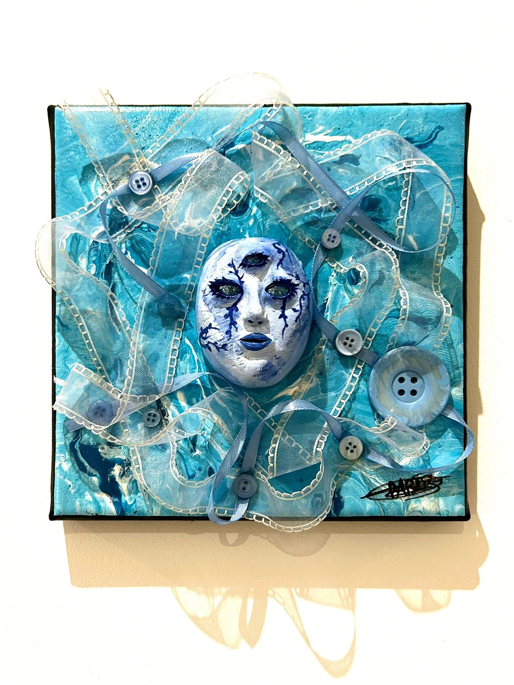 a painting of a face with a blue face and tissus