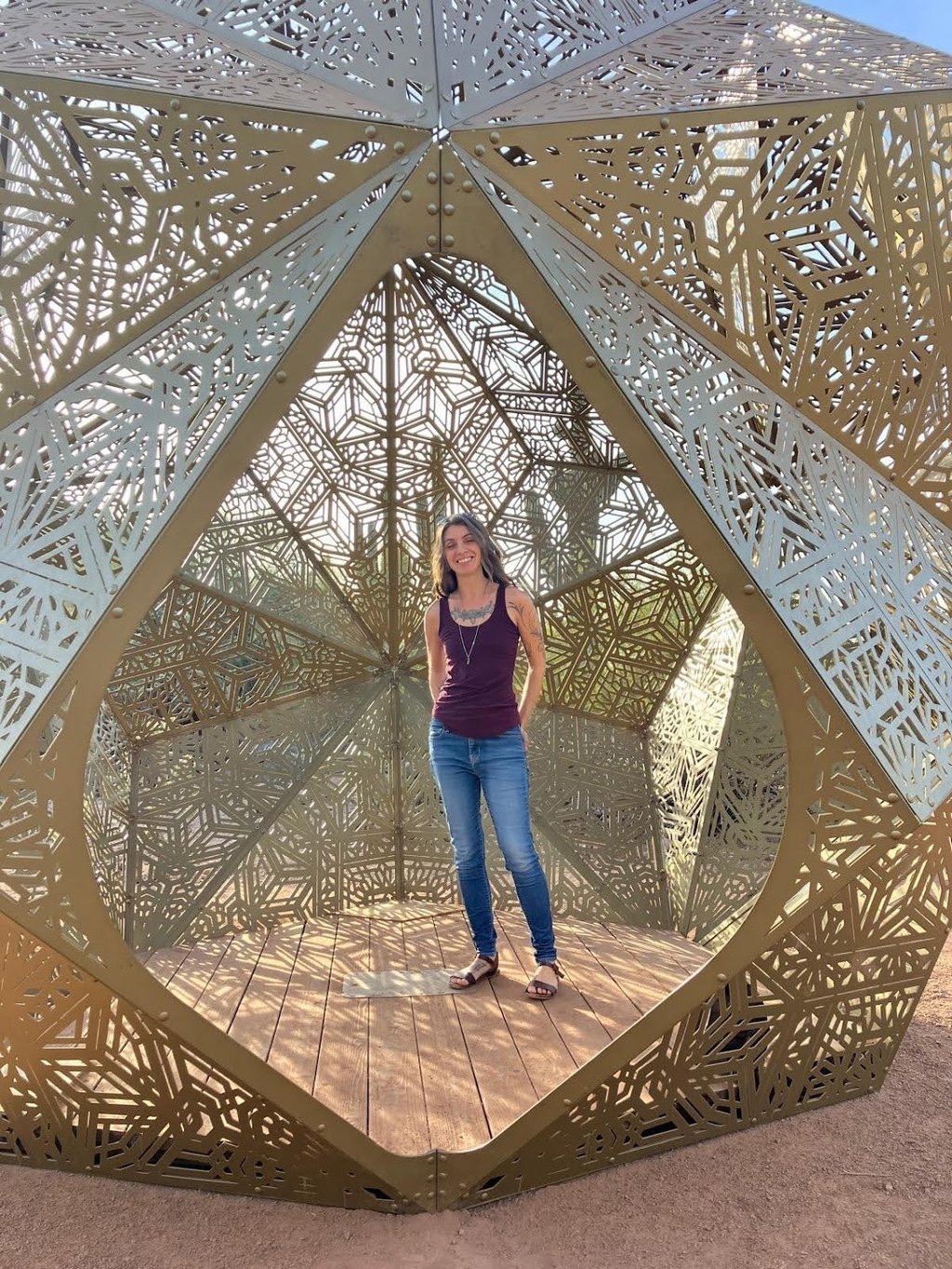 a photo of Danielle in an interactive geometric art sculpture