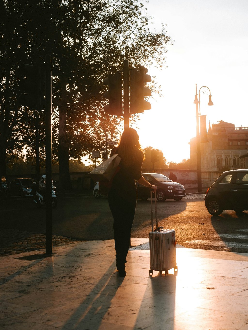 A lady passenger exiting Airport and walking towards her pre-booked taxi from Dibrugarh Taxi 24x7.
