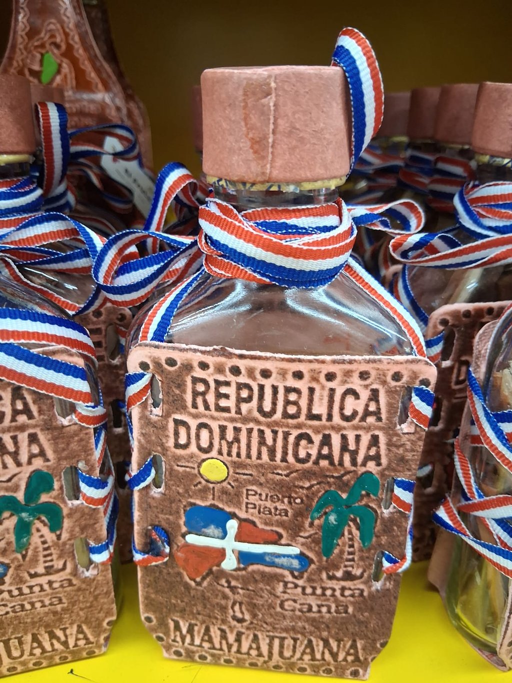 Mamajuana bottle souvenir with Dominican Republic label and ribbon in Punta Cana