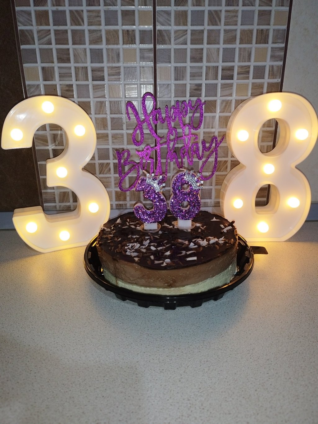 Chocolate birthday cake and cake decorations