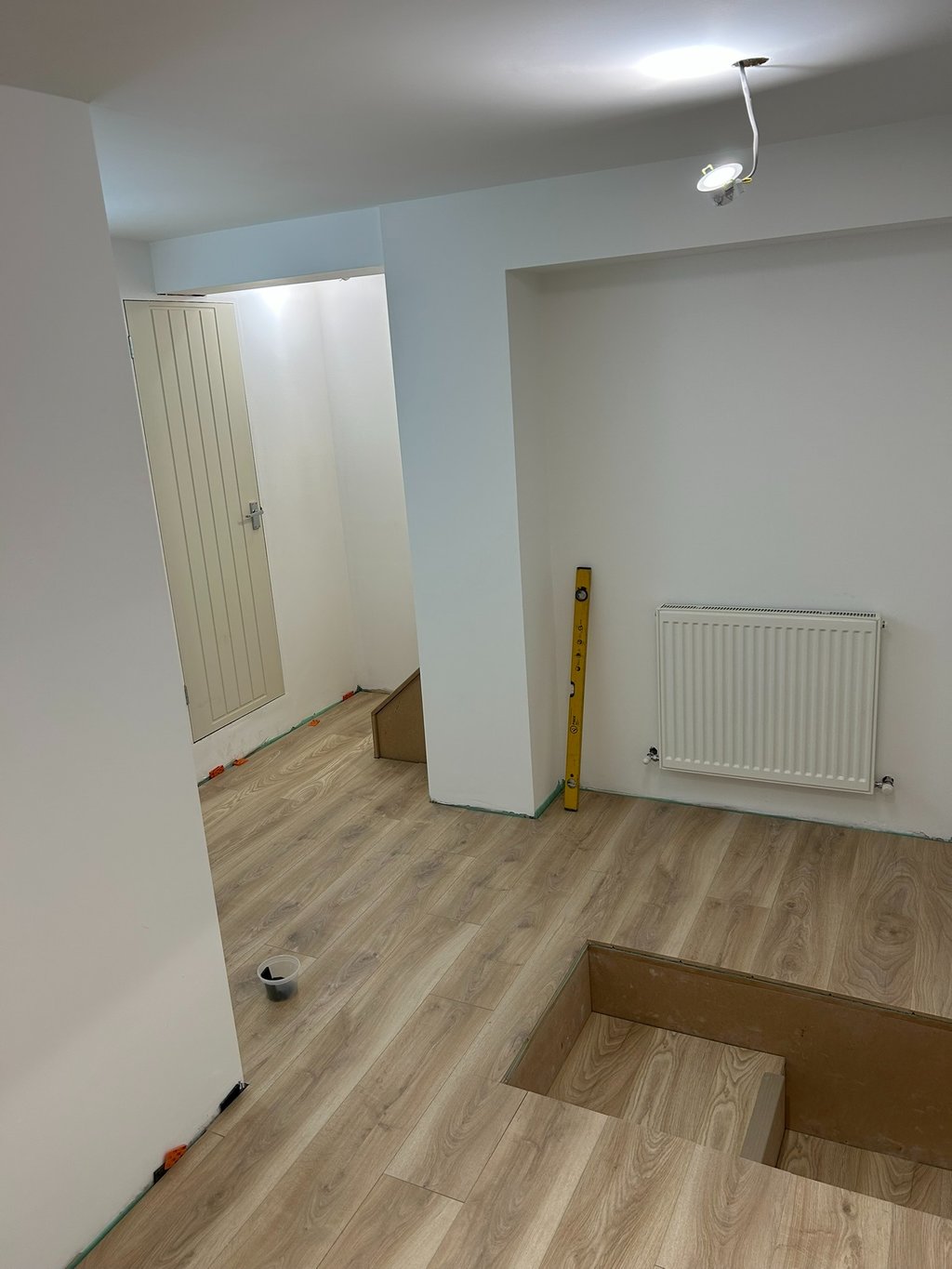 Plastered, floor down, just the skirting and a little painting to do!