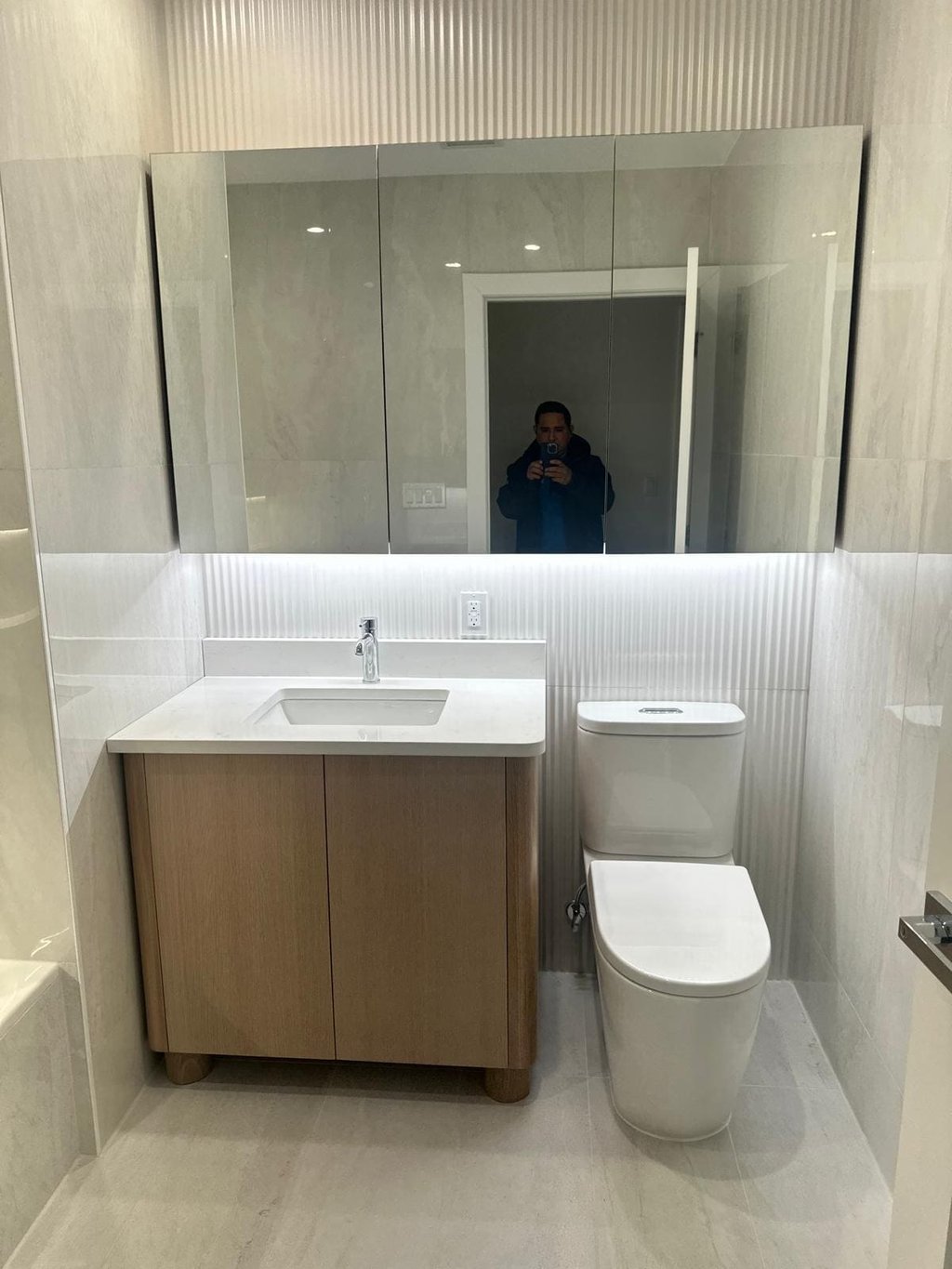 a bathroom with a toilet and a sink