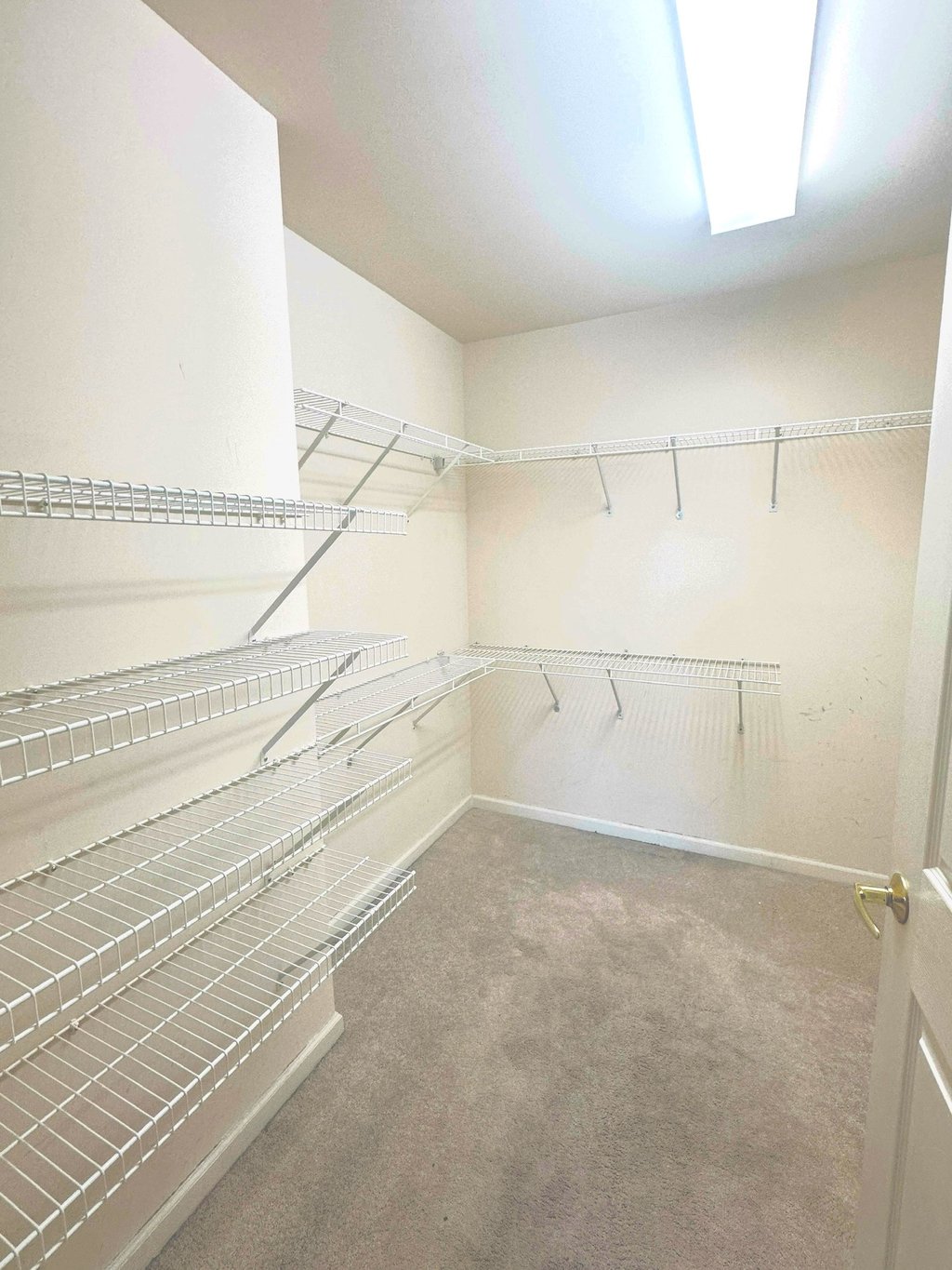 a closet with a closet space for clothes and other items
