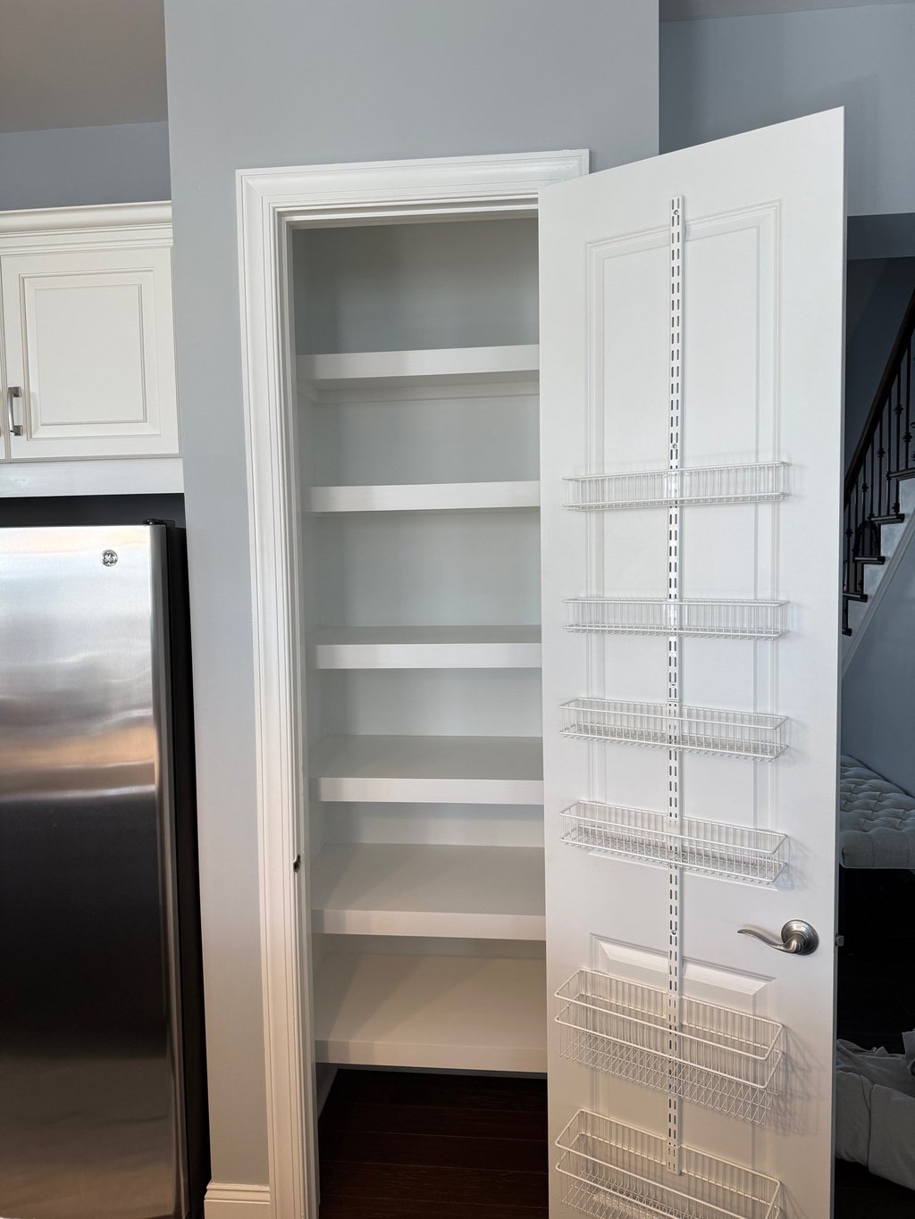 a kitchen pantry with a refrigerator and a refrigerator