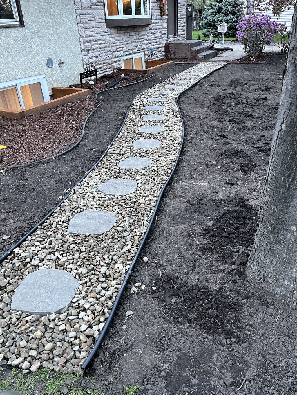 rock landscaping path for residential garden in central mn