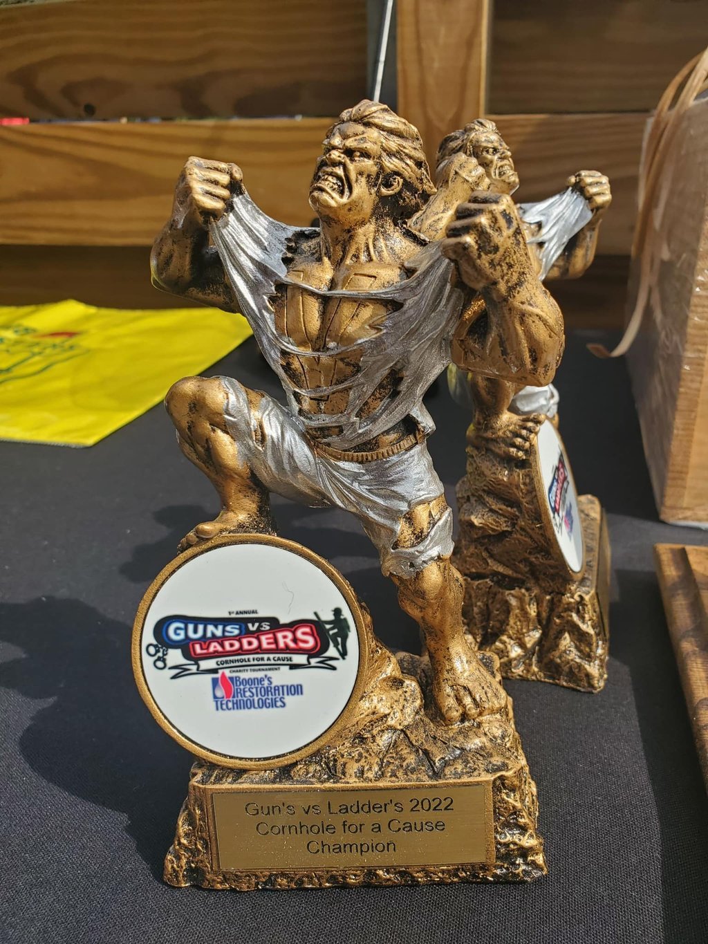 Guns vs Ladders Cornhole trophy