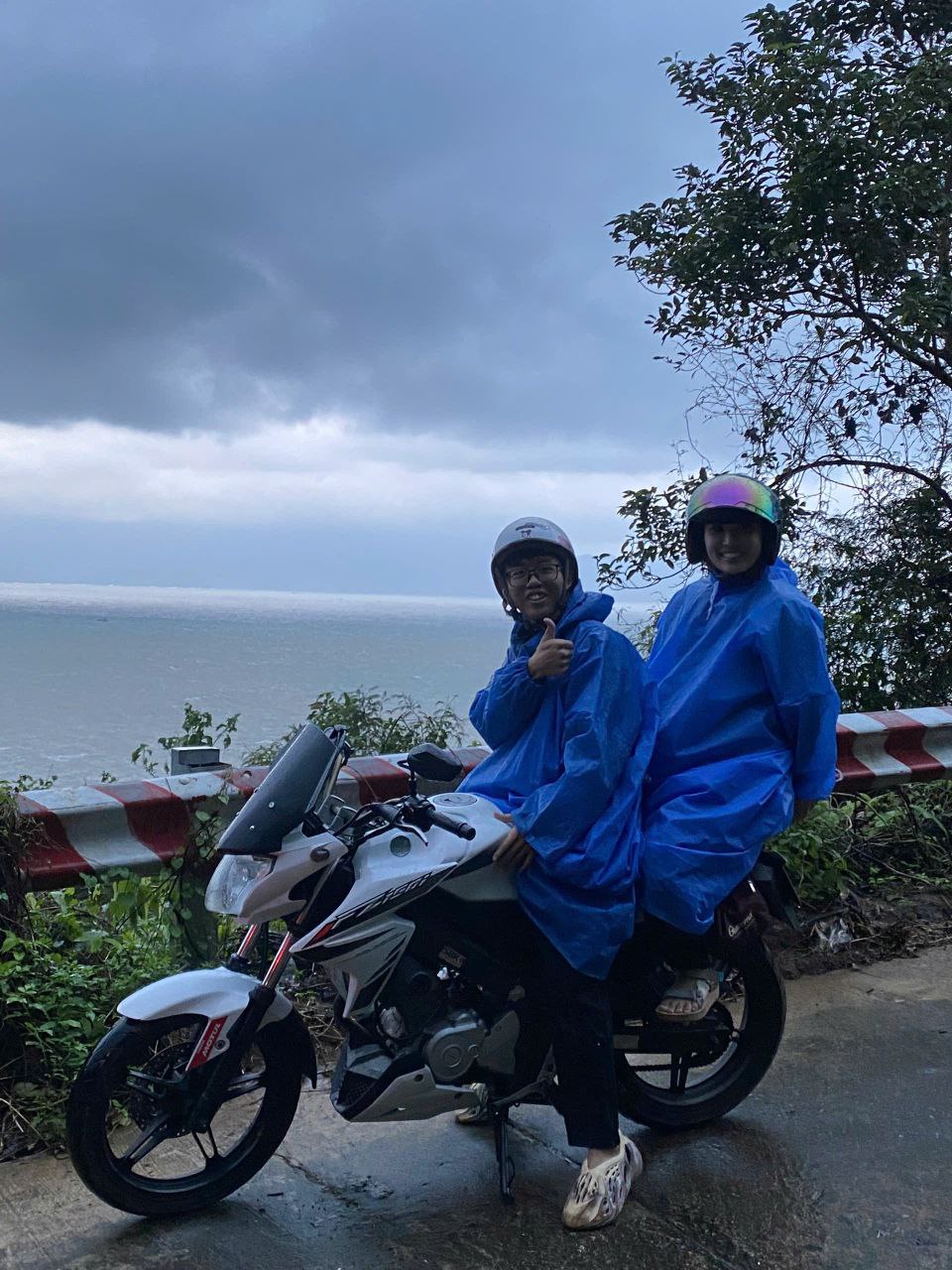 Happy customer experience the rain on Son Tra moutain, Da Nang.