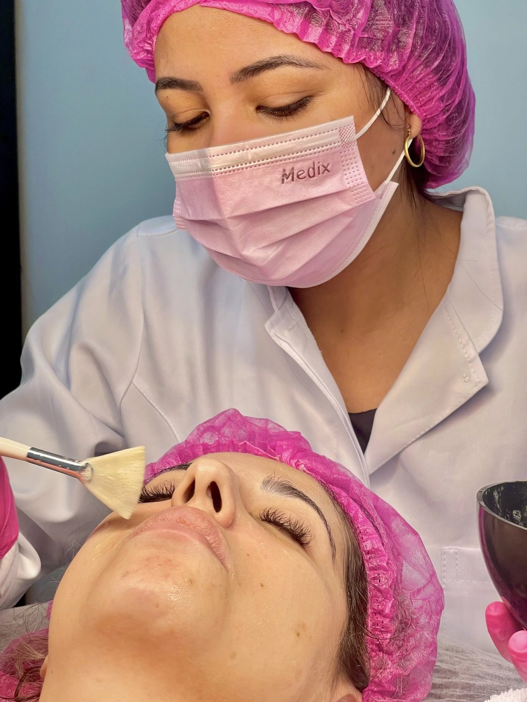 a woman getting a facial lift in a beauty salon