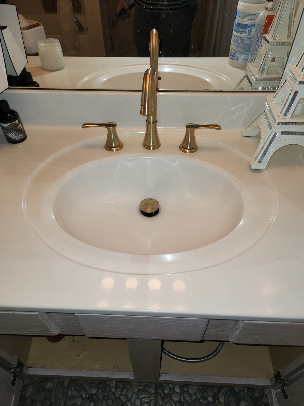 a sink with a sink and a mirror