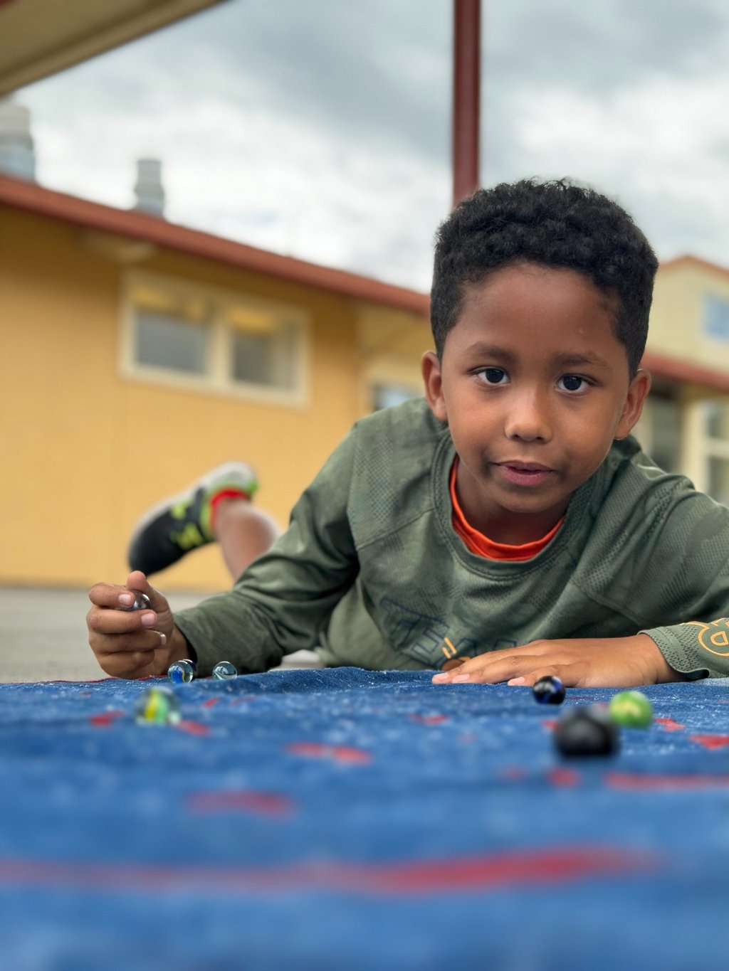 boy playing marbles