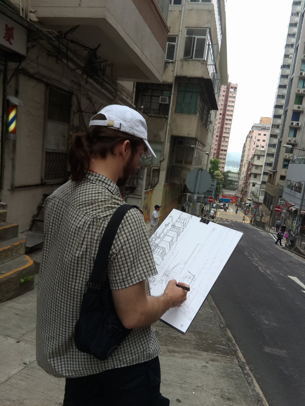 City sketcher Evgeny Bondarenko in Hong Kong
