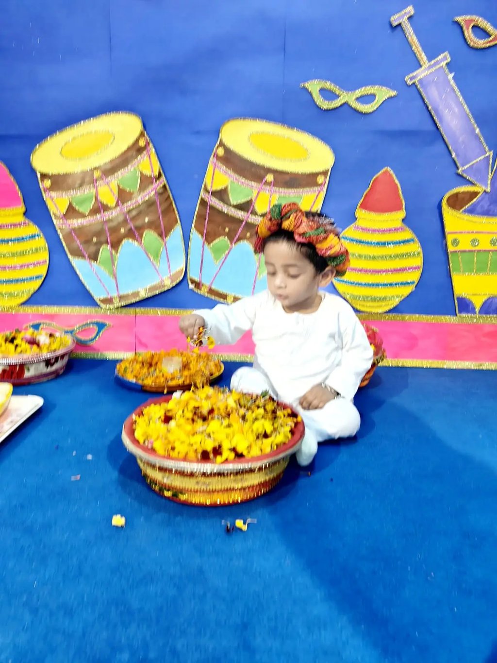 child playing with flower at Enfant pre school Ghaziabad