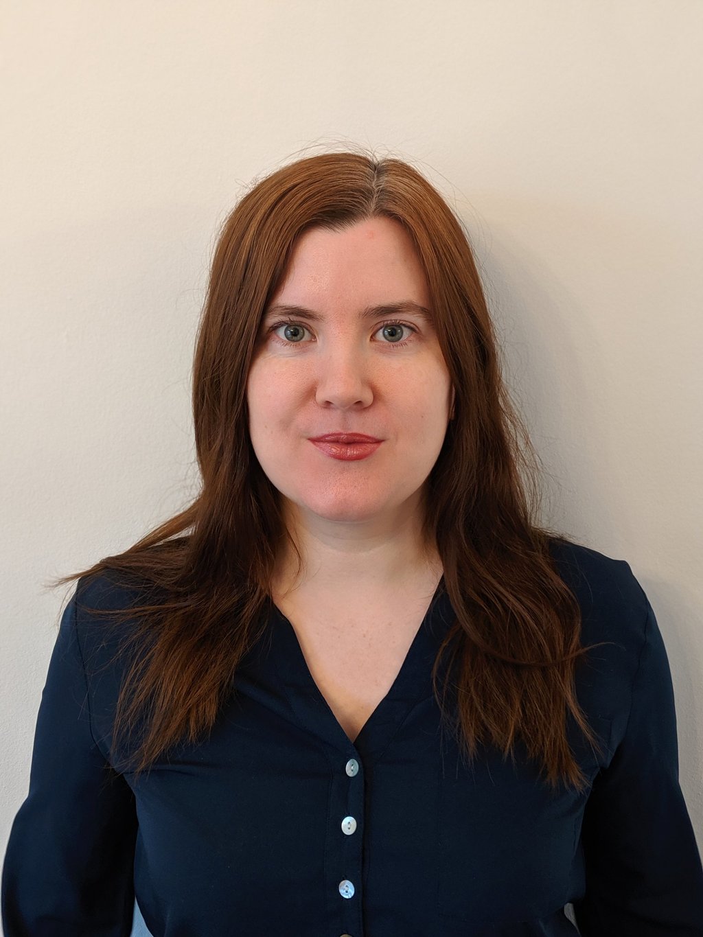 Adept Mediation professional female mediator smiling and looking directly at a client