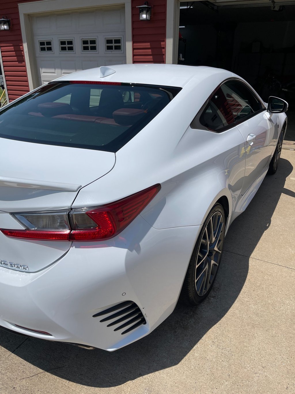 Professional auto detailing in Logan OH showing polished vehicle with mirror-like shine