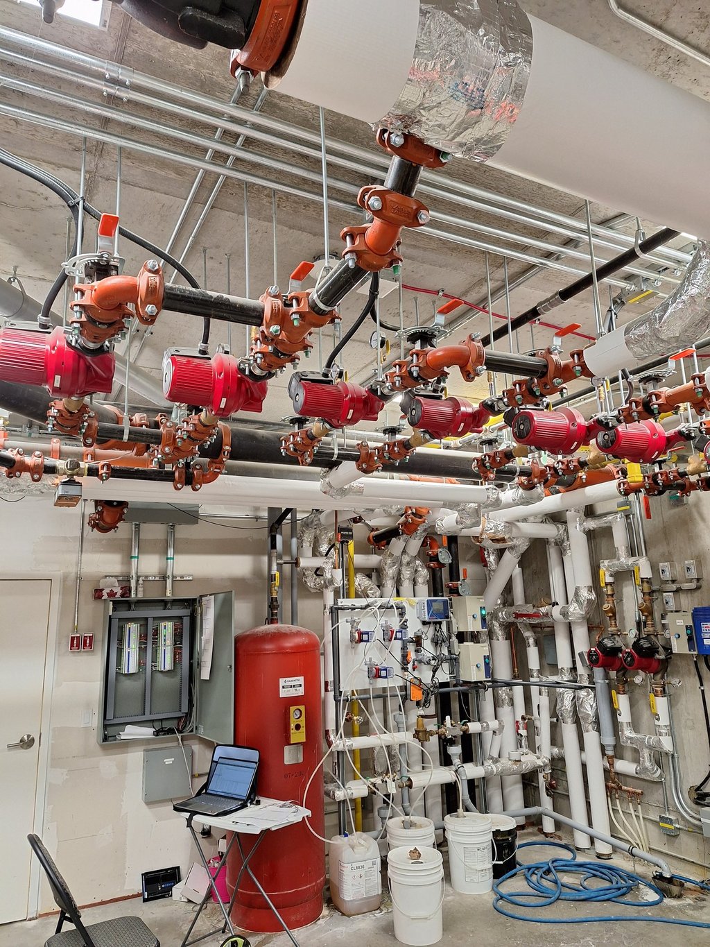 A commercial building mechanical system with HVAC controls