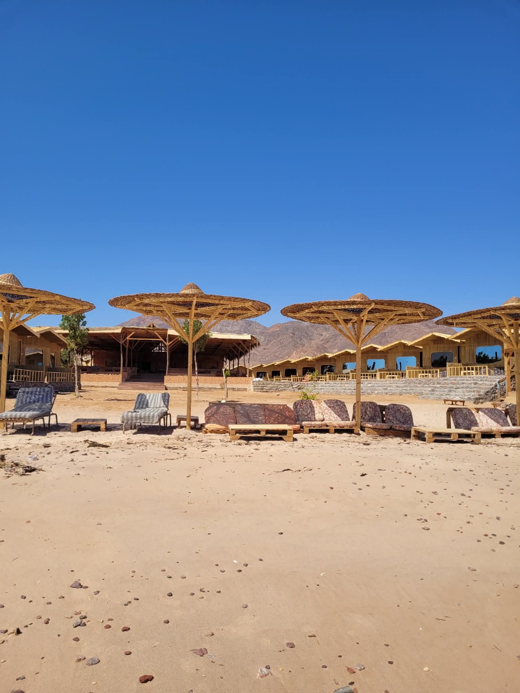 Sinai Life Camp beach view makeover Ras Shitan Nuweiba rooms and umbrellas by the Red Sea