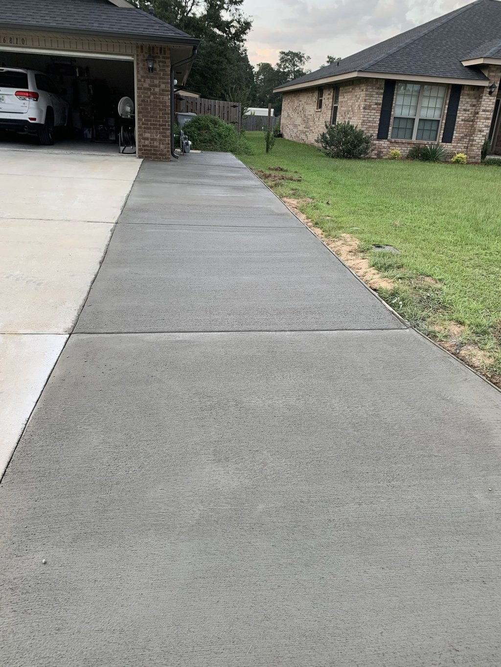 Residential concrete driveway in Navarre FL with durable, clean finish