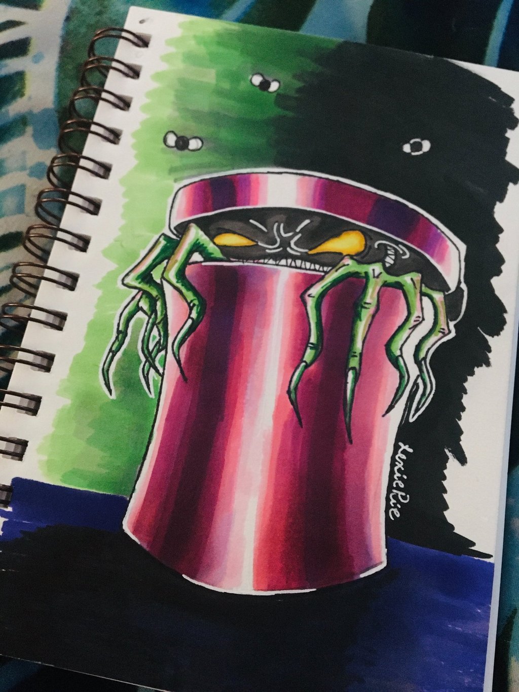 a marker drawing of a green trashcan goblin in pink trashcan.