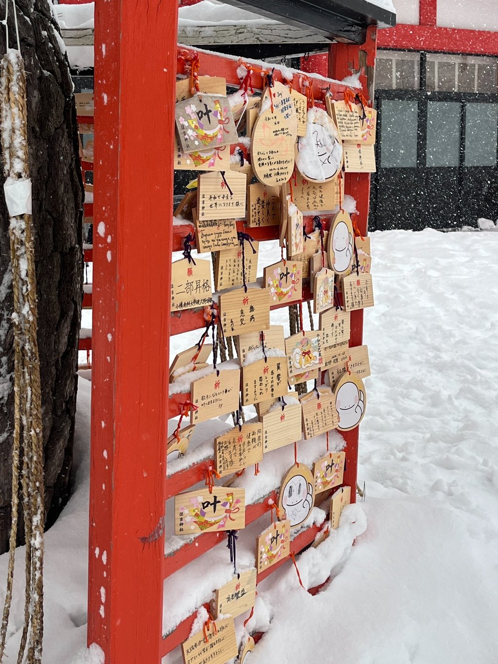 a wooden sign called ema in a temple in otaru hokkaido japan