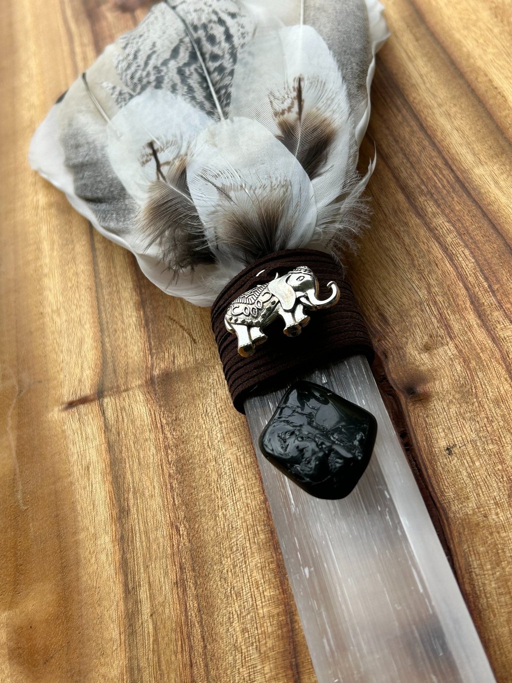 Handcrafted selenite healing wand with feather for energy clearing and smudging