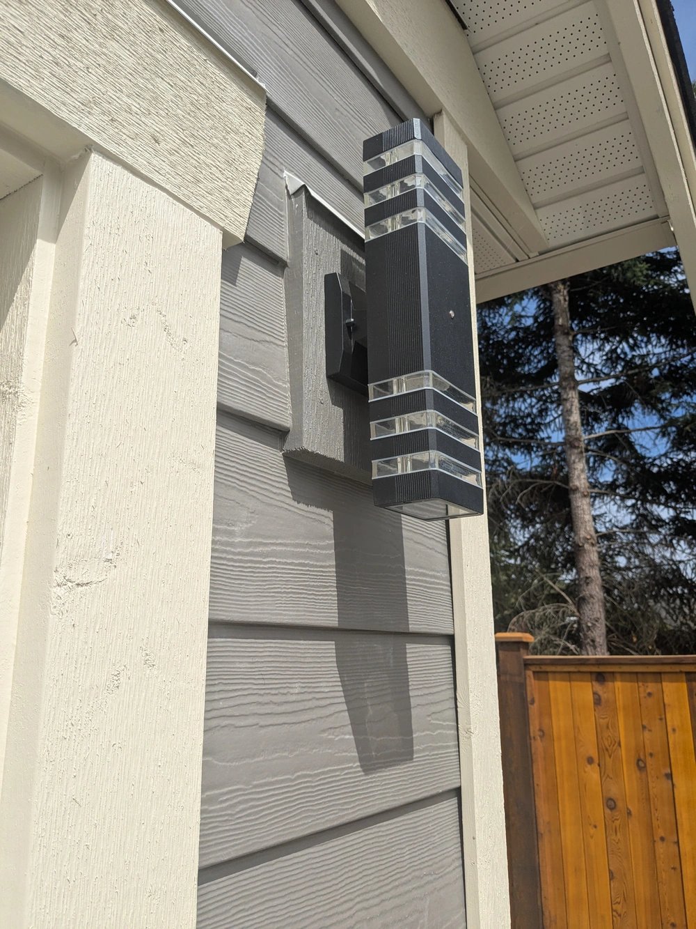 Siding and exterior light with weatherproof sealing and careful trim painting