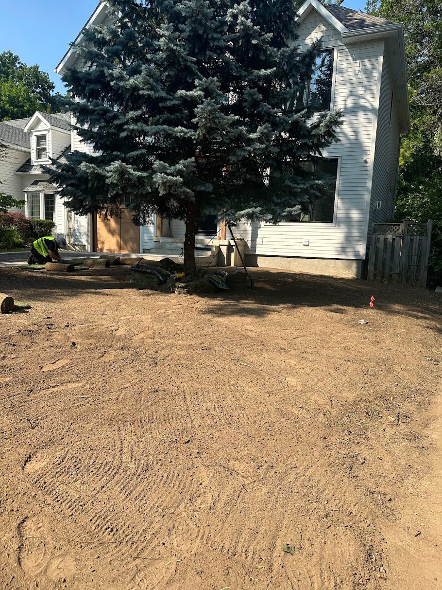 Residential lawn being graded before sod installation