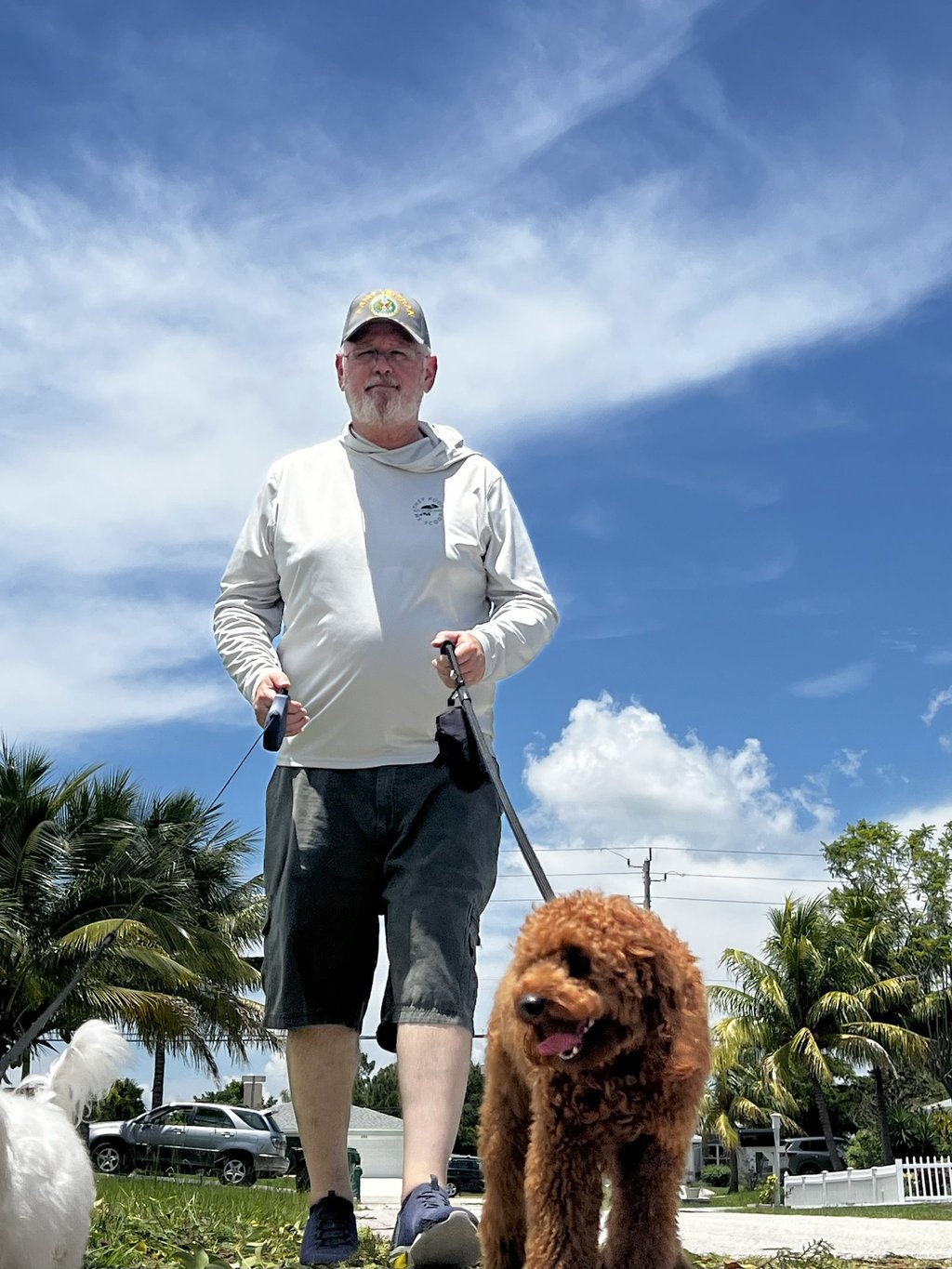 Robert walking a dog on a leash