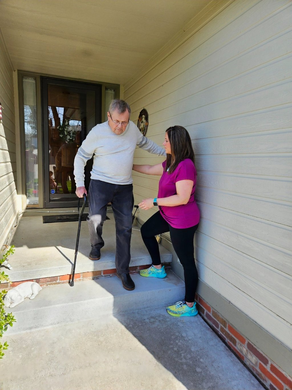 Physical therapy: stair training for a geriatric patient at home.
