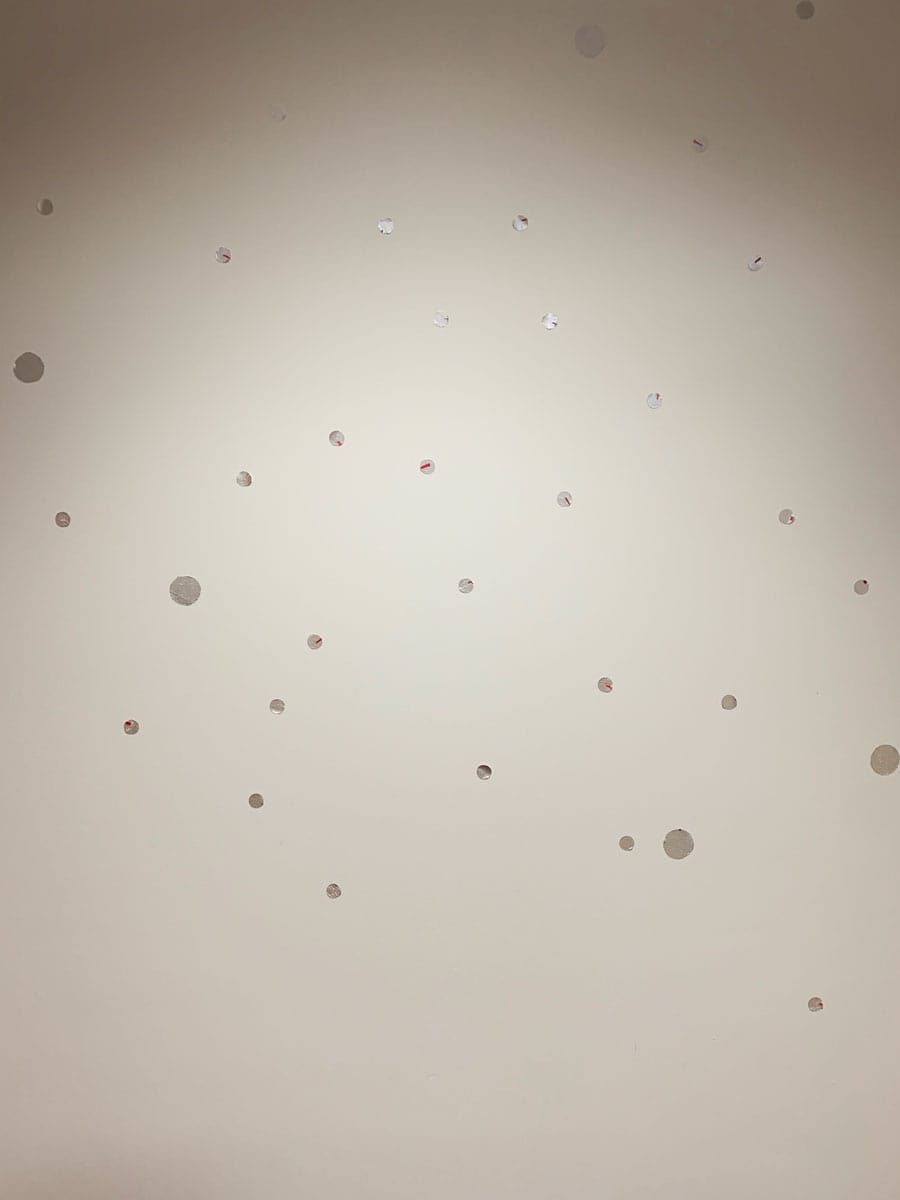 Silver dot decals on white wall, elegant and playfully spread by House of Lyria