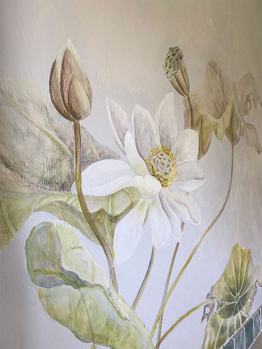 Spa bath mural with white lotus flower and lotus seedpod with koi fish taking refuge amongst flora.