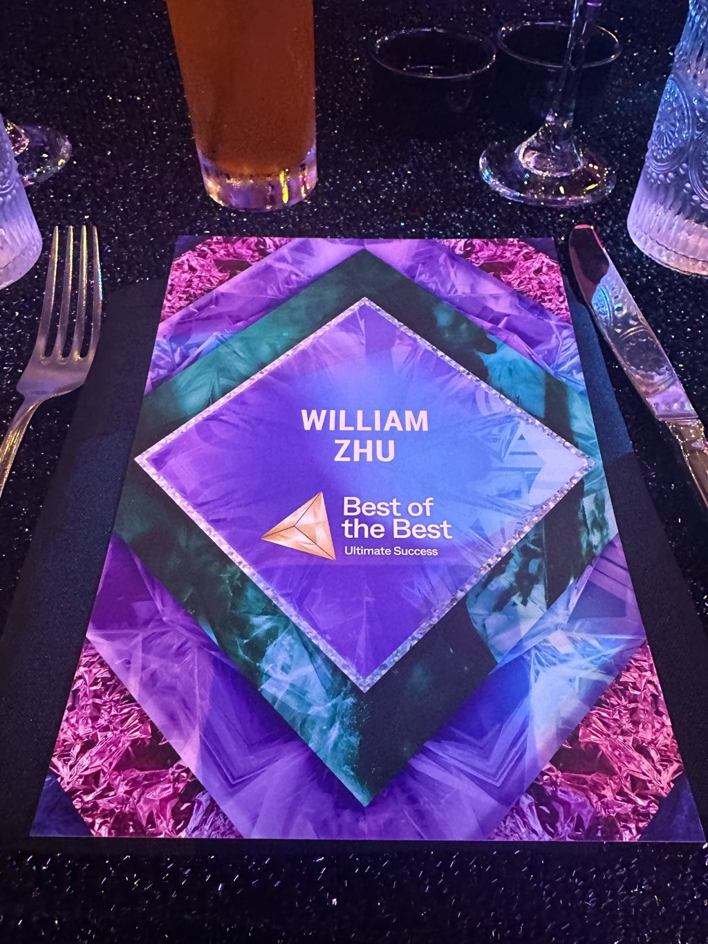 William Zhu broker award at an industry recognition event