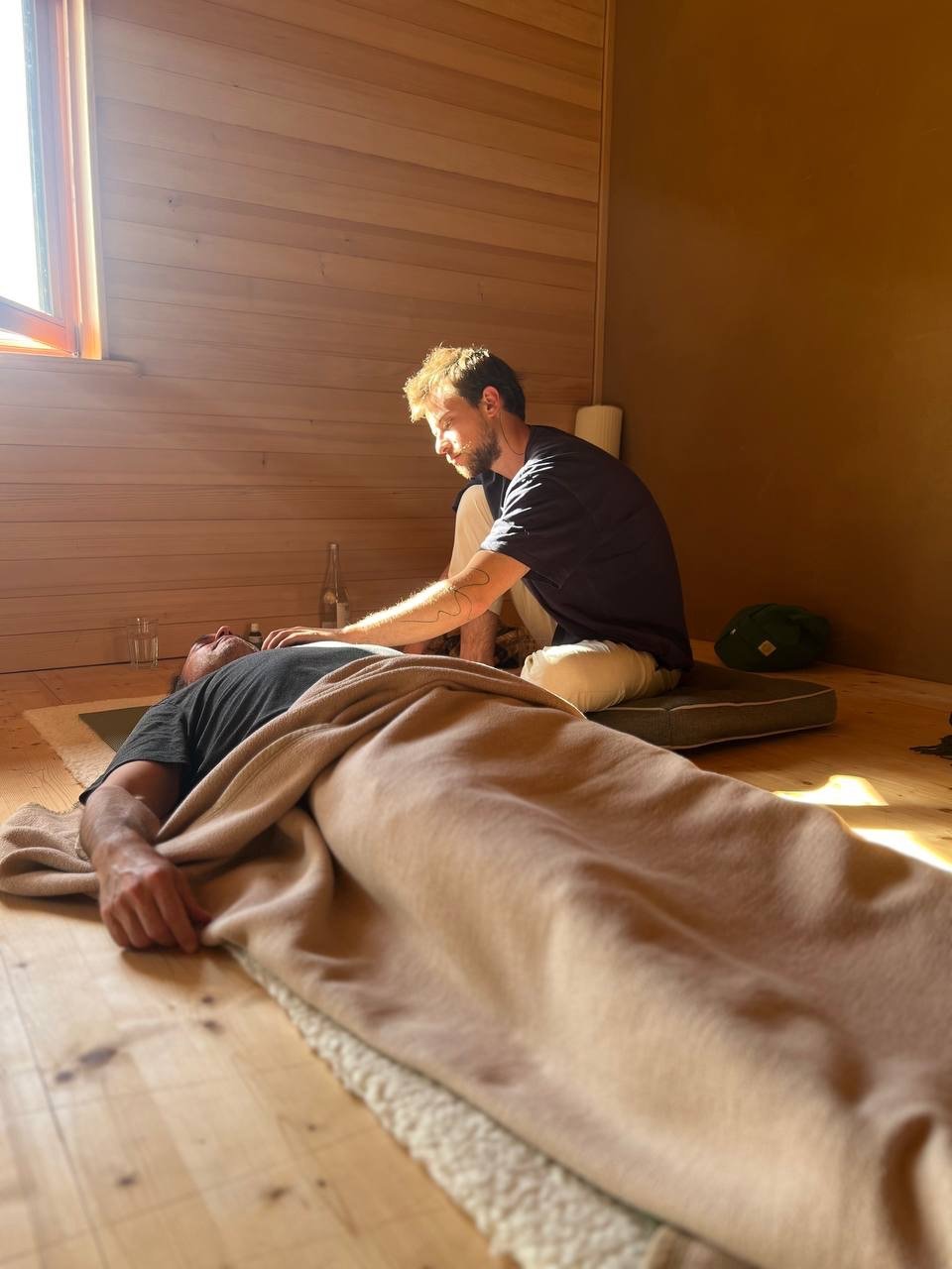 A person guiding a breathwork session 