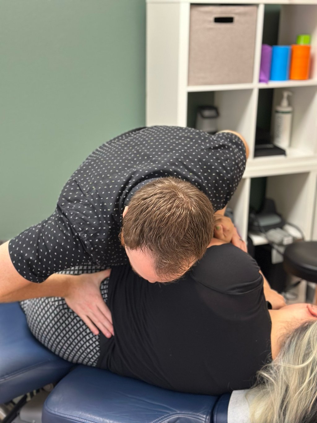 Dr. Frost giving a low back adjustment to patient in Royal Palm Beach FL