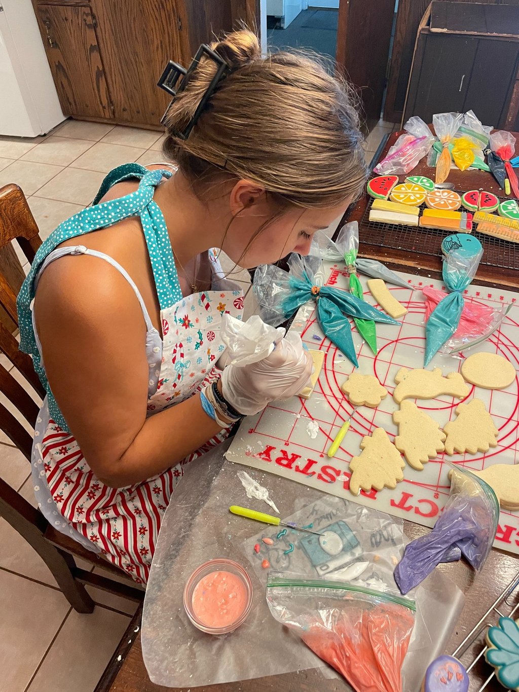 A Real in the moment photo of what it looks like to decorate these cookies
