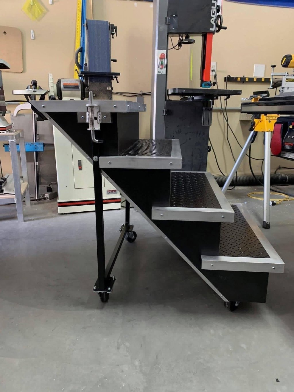 deceptive stairs with black diamond plate treads and locking casters in KMD studio.