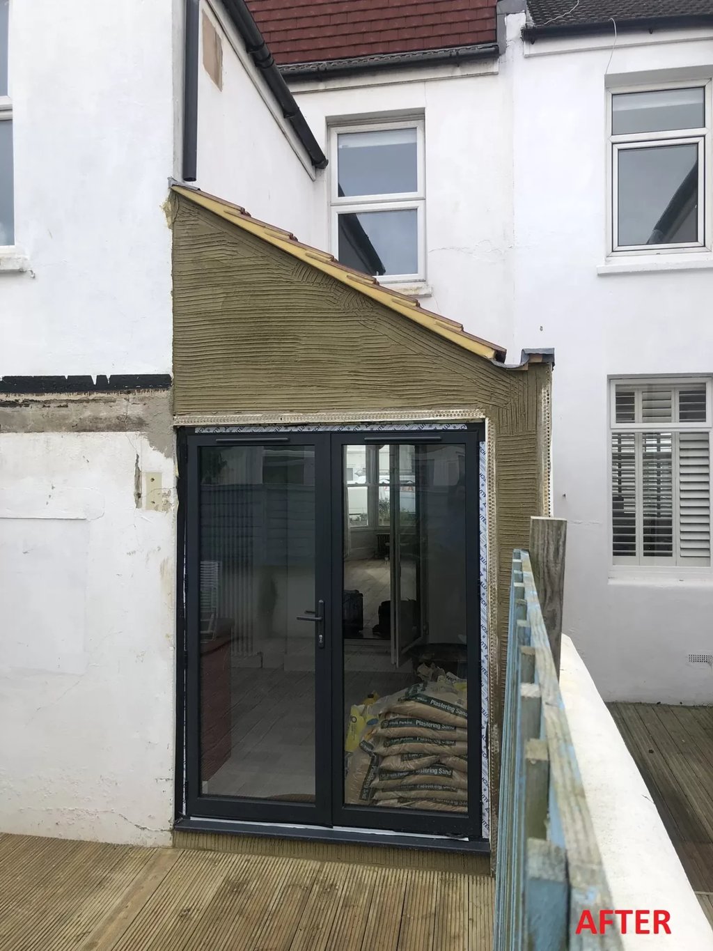 Rear house extension with new patio doors on Brighton property.