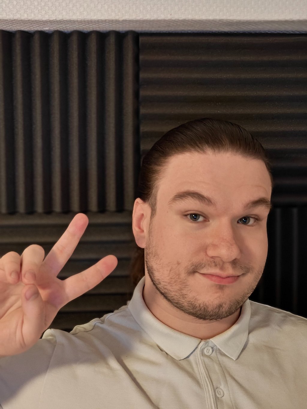 a man with a beard and a white shirt