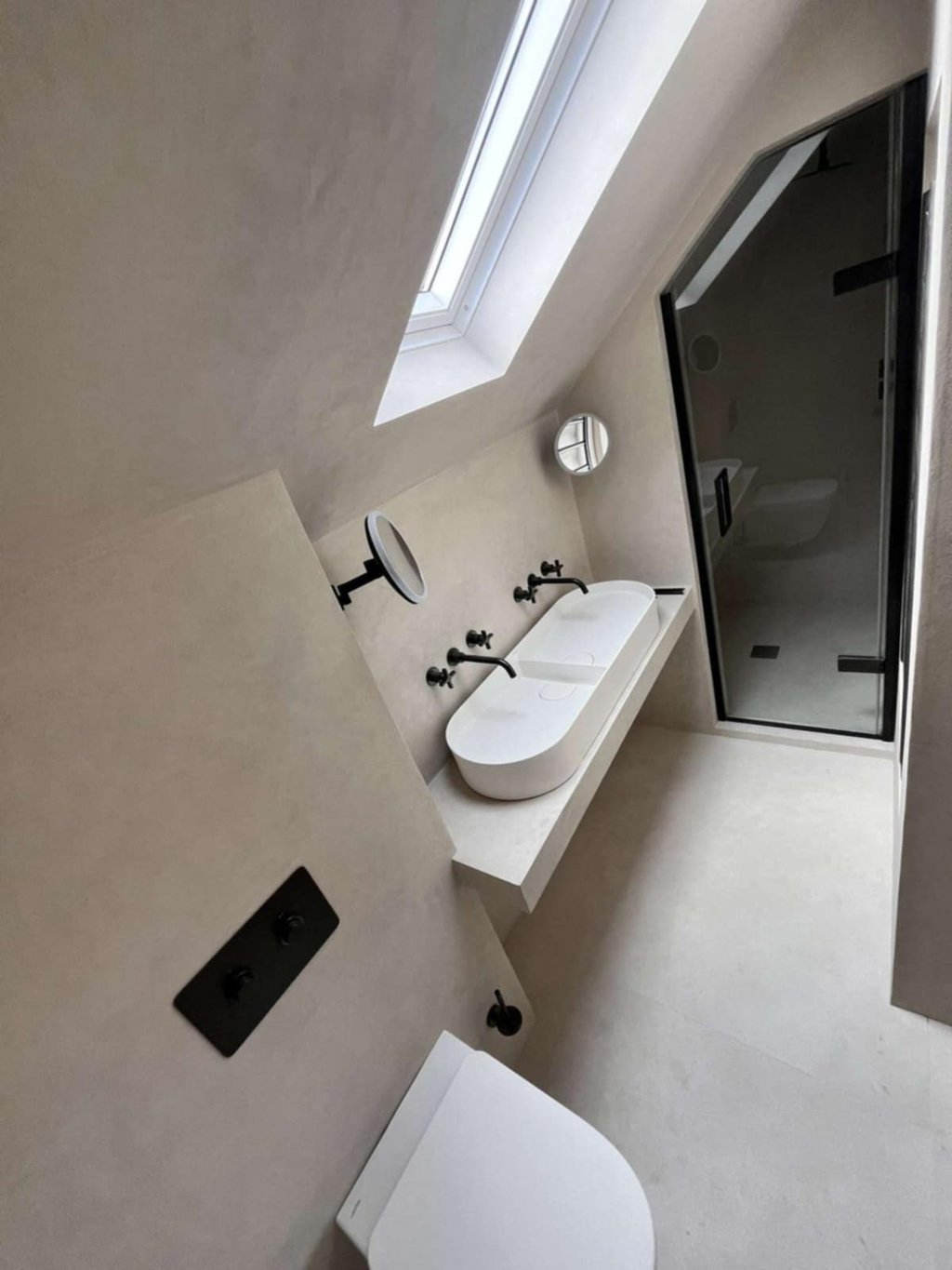 modern bathroom with freestanding bathtub and wall-mounted tap in Evesham