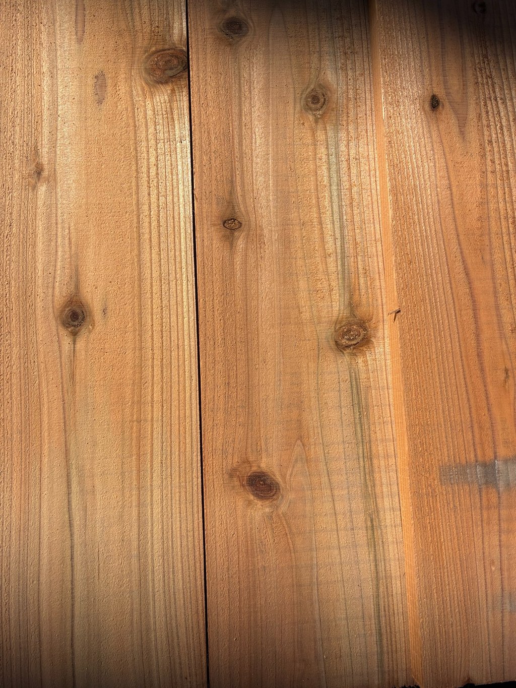 Natural cedar wood planks with visible grain patterns and knots for rustic lumber texture.