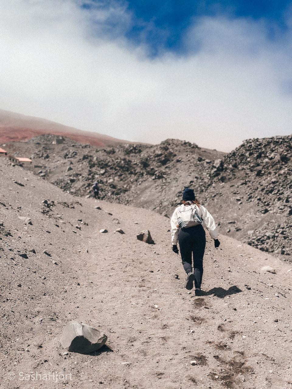 Girl hiking on the Volcano Cotopaxi in Ecuador, South America